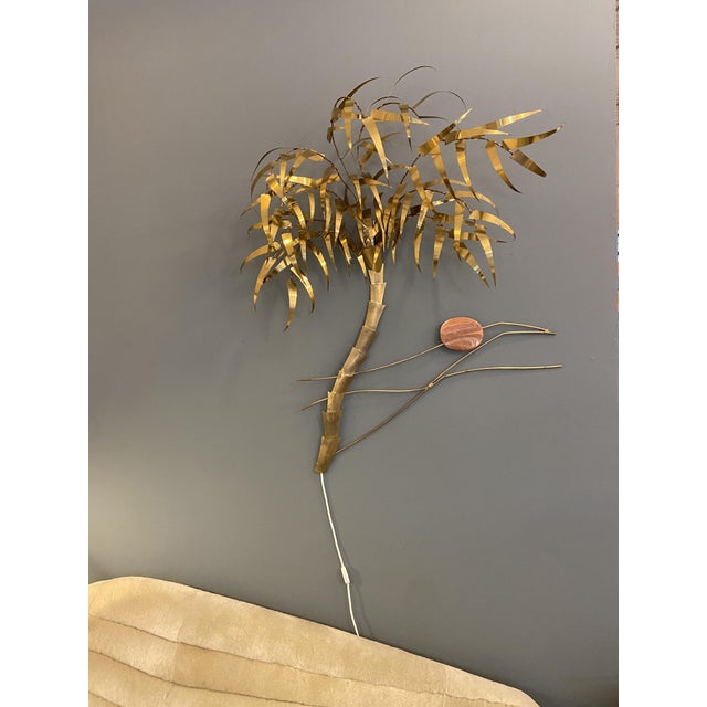 Sculptural wall sconce by Belgian sculptor Daniel Dhaeseleer, handcrafted brass leaves and a copper sun, which hangs from...