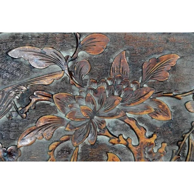 A 19th century lacquered Chinese wall plaque hand-carved in rosewood. This rectangular plaque displays a lobed medallion...