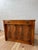 A distinguished extending sideboard cabinet by the renowned Saginaw Furniture Company, crafted in richly figured mahogany...