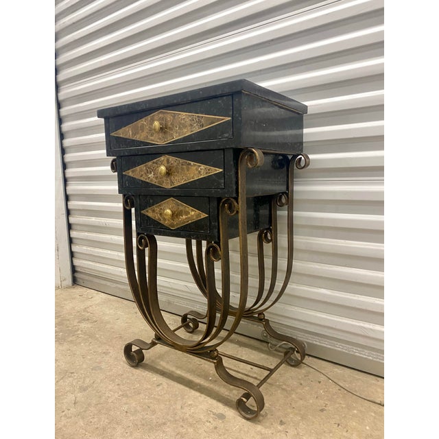 This item is a vintage accent cabinet, or small Credenza designed in an Art Deco or Hollywood Regency style. It features a...