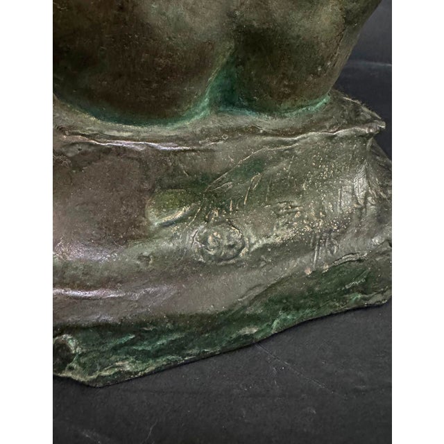 The powerful figure of Adam, depicted crouching in fear and shame following his expulsion from the Garden of Eden, is...