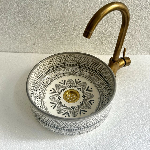 Experience the beauty of your bathroom with our elegant gray vessel sink, lovingly handcrafted by skilled Moroccan...