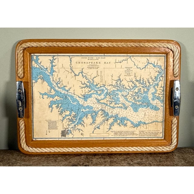 This serving tray features a wood frame inset with a reproduction nautical chart of Chesapeake Bay, Maryland. The oak...