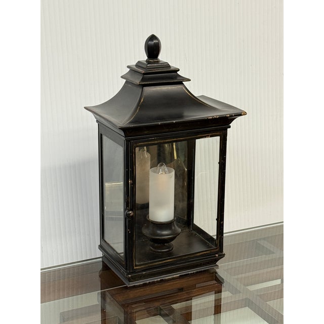 Design Plus Gallery presents a Small Burnished Metal Pagoda Wall Sconce. The sconce has the ability to sit upright on a...