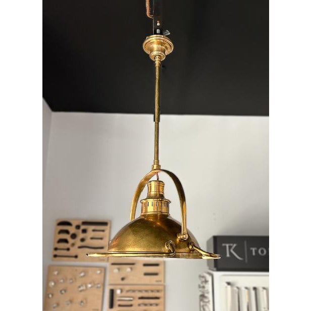 This gorgeous nautical-inspired pendant light is a great way to bring some coastal aesthetic into your home. The piece...