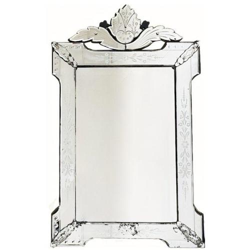 This antique Venetian mirror features beautiful etched glass with flowers and dates from around the 1900s. This antique...