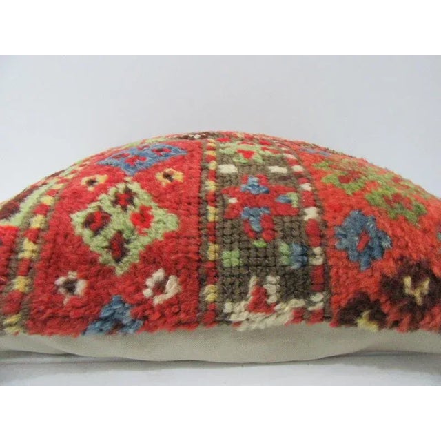 This is a pillow cover made from a vintage kilim rug. The piece was properly washed and ready to use. Pillow inserts not...