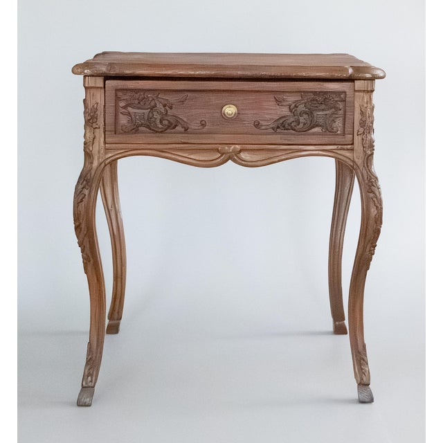 A lovely antique 19th-Century French oak hand carved side table or accent table. This beautiful table has hand carved...