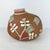 This is a hand‑coiled, hand‑carved pottery vessel by Taos Pueblo artist Camille Bernal, known for her organic sculptural...