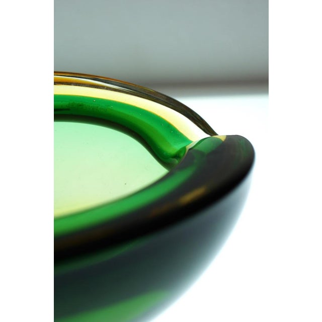 An extraordinary and substantial handmade vintage glass bowl or centerpiece dish from Murano, Italy made during the 60s....