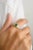 Experience timeless elegance with our 18K cushion cut center stone emerald wedding ring, adorned with chunky diamonds....