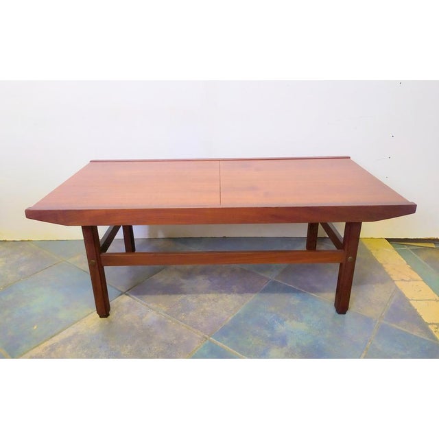 Italian-made opening coffee table from the 1950s. Unknown designer but in the style of Ico Parisi. Inside there is a white...