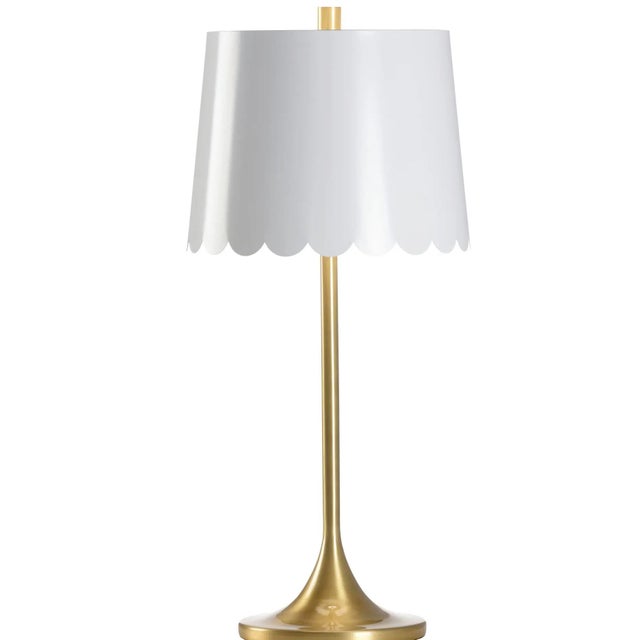 Designed for Wildwood by Meg Braff Designs. A sleek brass lamp with a playful scalloped tole shade. Switch type, 3-Way....