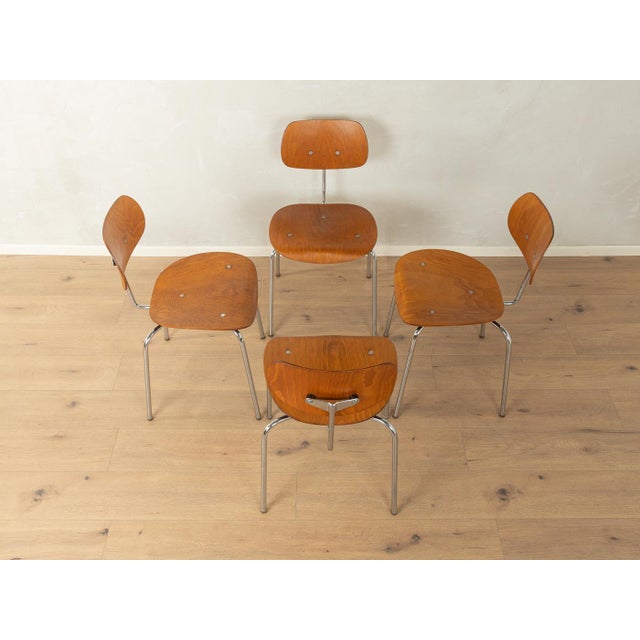 Classic SE 68 dining chairs from the 1950s by Egon Eiermann for Wilde & Spieth. Stainless steel frame with a seat and...