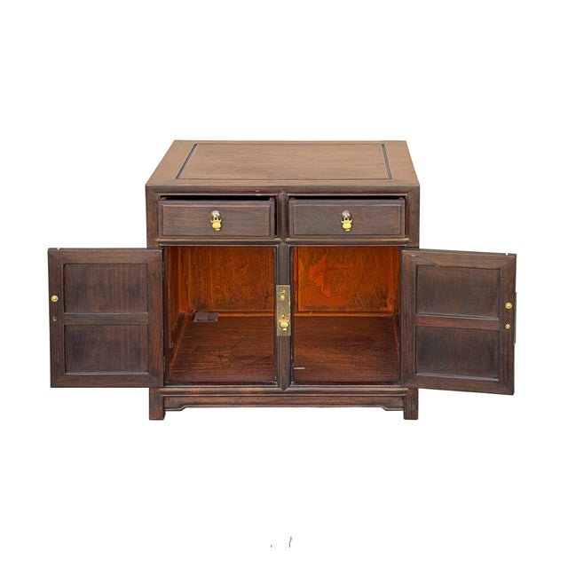 This elegant Ming-style accent cabinet is crafted from wood with a rich, dark espresso finish that beautifully showcases...