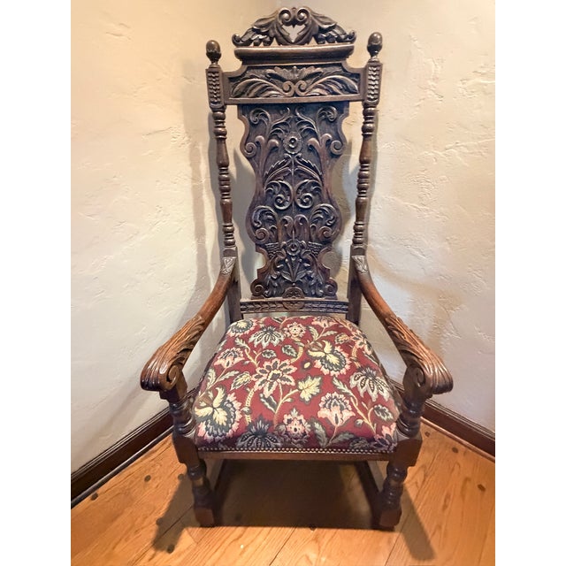 This set of 8 Late 19th Century Antique English Gothic Revival Carved High Back Dining Chairs smoothly blend refinement...