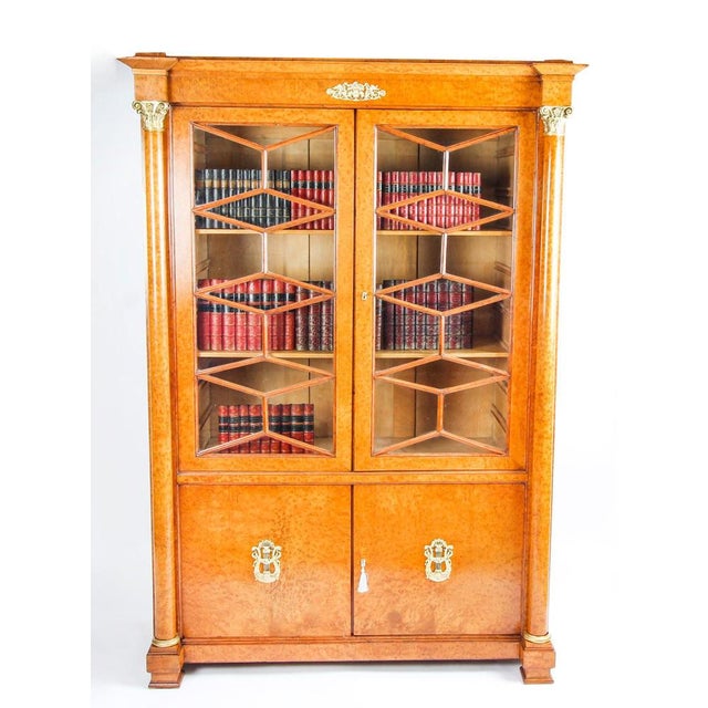 This is a beautiful antique french charles x burr maple bookcase with fabulous ormolu mounts, circa 1820 in date. It has...