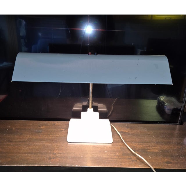 This is a vintage "Sightmaster" style fluorescent desk lamp likely manufactured by the Art Specialty Company of Chicago,...
