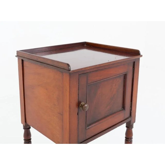 Regency mahogany bedside cabinet This cabinet is raised upon ring turned legs Period Regency antique - circa 1910 Having a...