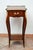 Antique French Napoleon III side table crafted from fine exotic woods with inlays of gilded bronze. The tabletop features...