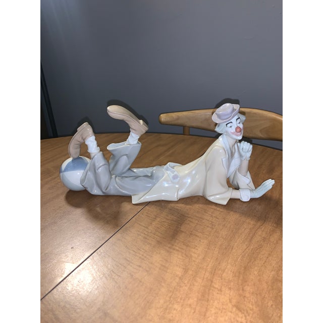 This Lladró Porcelain Clown with Ball Figurine (#4618) is a retired vintage collectible, perfect for adding a touch of...