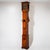 Large cherrywood grandfather clock raised on ball feet and decorated with framed marquetry inlays. The clock case features...