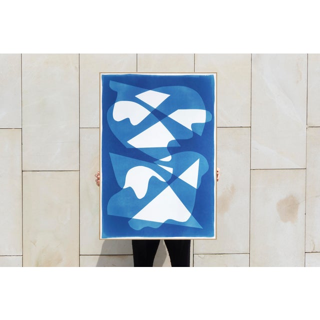 This unique monotype cyanotype, rendered in rich blue tones, draws inspiration from mid-century modern shapes to explore...