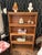 Handsome vintage 4 tier wooden and glass barrister or lawyer bookcase with front lift up doors and a golden oak finish....