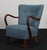 Alfred Christensen lounge chair new upholstered with light blue/turqiose wool. Armrests of stained oak, legs of stained...