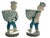 Pair dapper, chinoiserie monkeys toting artichoke planters/bowls. Pedestal features a Greek key band around the base. The...