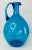 Vintage 1960s Blenko Style Blue Glass Jug with an applied handle and a rolled lip. Beautiful classic blue color, this jug...