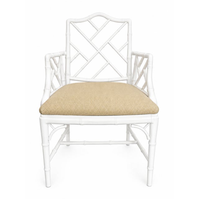 Vintage Chinese Chippendale–style faux bamboo armchair featuring an elegant geometric lattice back and coordinating...