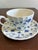 A classic English teacup and saucer set in the sought-after Finlandia pattern by Myott. Featuring a timeless blue and...