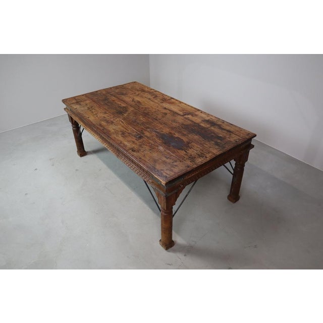 Unique handmade dining table made of recycled teak wood, originating from Indonesia. This table combines authentic...