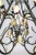 A sizable chandelier of curling branches in the form of an upside-down heart with two tiers of stone spears and 6 lights....