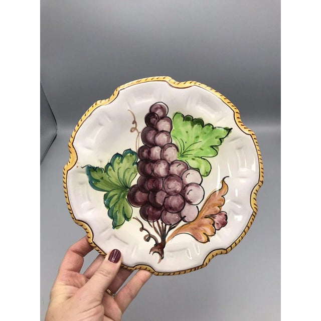 This eye-catching vintage Majolica Handpainted Italian Decorative Plate with Grape Design and Scalloped Edge is a stunner!...