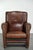 This Art Nouveau-style sheepskin armchair is crafted in a dark brown color. The armchair features a removable seat...