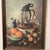 This vintage wood framed print by Hank Boj showcases a beautiful still life of fruit and nuts. The canvas material adds a...