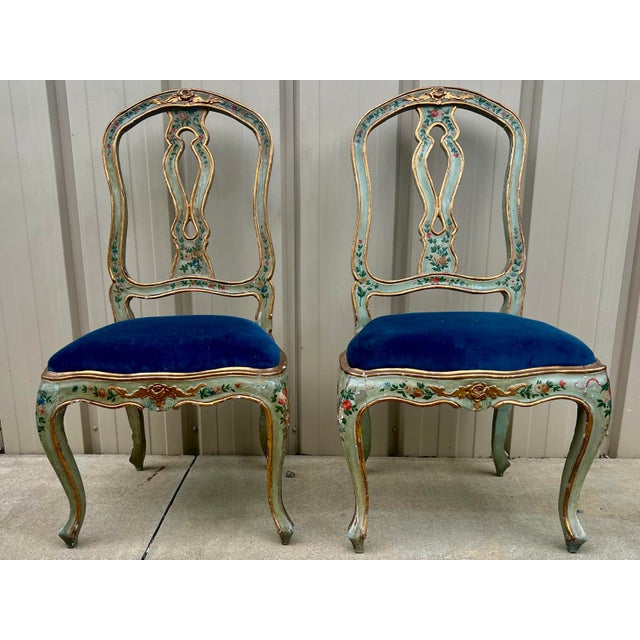 This is a pair of 19th century hand painted Venetian side chairs. The seats are in a blue velvet that is in very good...