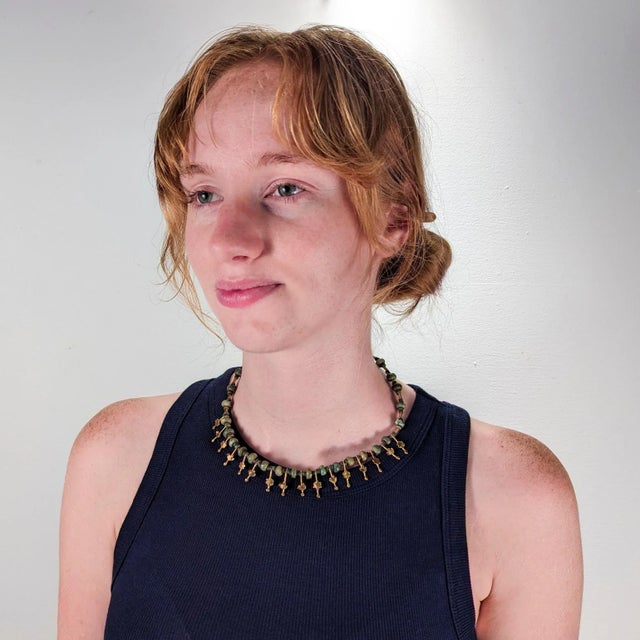 A fine Etruscan Revival style necklace. By the New York City Modernist female goldsmith Resia Schor. In 14k gold. Set with...