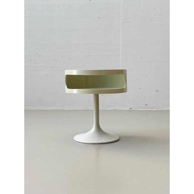 The Luna side table is a classic example of 1970s space-age design. The round tabletop rests on an elegant tulip-shaped...