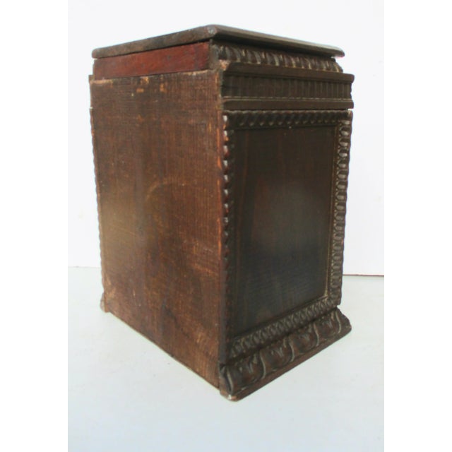 Folk art desktop storage box. Roll-top face with egg and dart wooden molding capping the top and around the base. The dark...