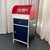 This charming vintage storage cabinet captures a delightful slice of nostalgic Americana with its whimsical design...