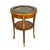 This elegant French round side table exemplifies the refined craftsmanship and luxurious materials associated with early...