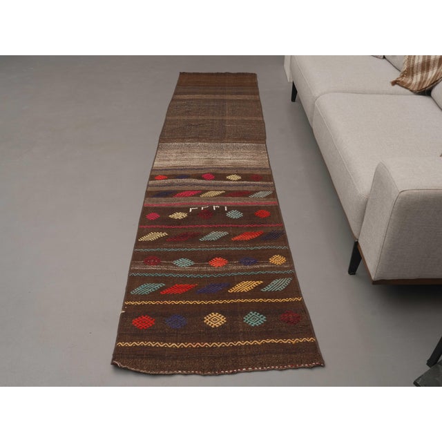 Vintage Hand-Knotted runner rug is a semi-antique vintage runner rug. The '70s Eastern region of Anatolia's unique rug is...