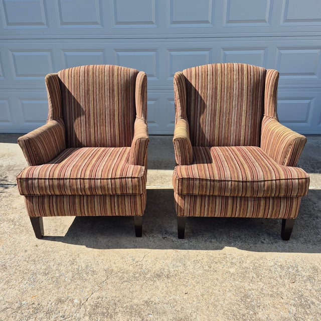 This is a handsome pair of large-scale modern wingback chairs by American furniture maker Stratford, a division of Caye...