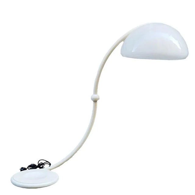 Iconic and beautiful floor lamp with a round and revolving shape Mod. Serpente, Designer Elio Martinelli for Martinelli...