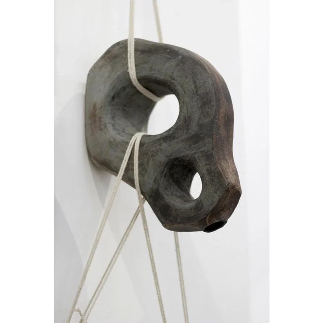 Generation 02 by Eguzkiñe Egaña Unique Dimensions: W 27.5 x L 11 x H 38 cm Materials: Black stoneware, slip and rope In...