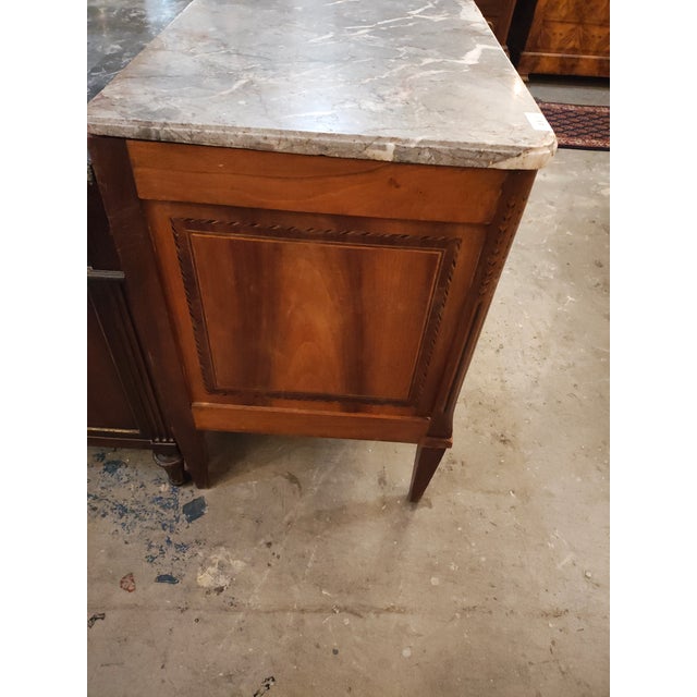 An exceptional Circa 1780–1790 French Louis XVI–style commode, likely originating in the Île-de-France region,...