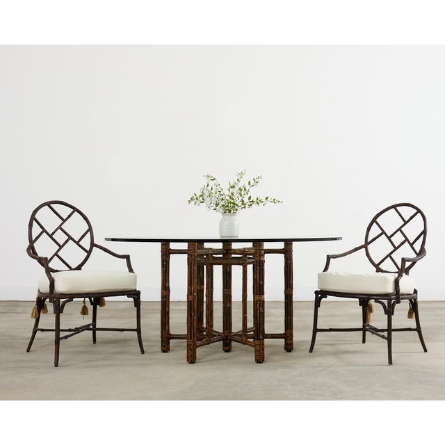 Genuine McGuire organic modern round dining table featuring a hexagonal shaped base. The iron base is painted golden gate...